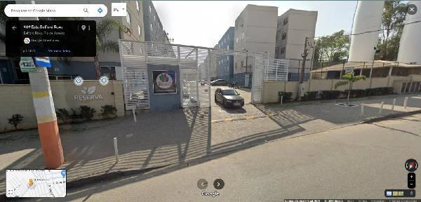 Apartamento branco em condomínio Reserva Belford Roxo com portaria e acesso por rua pavimentada