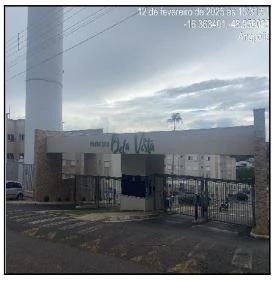 Apartamento com fachada do condomínio Residencial Premiere Bela Vista, portaria com guarita e grades de acesso